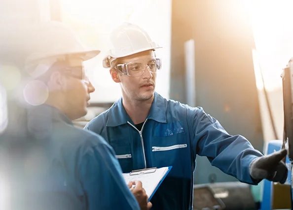 technicians performing air compressor maintenance